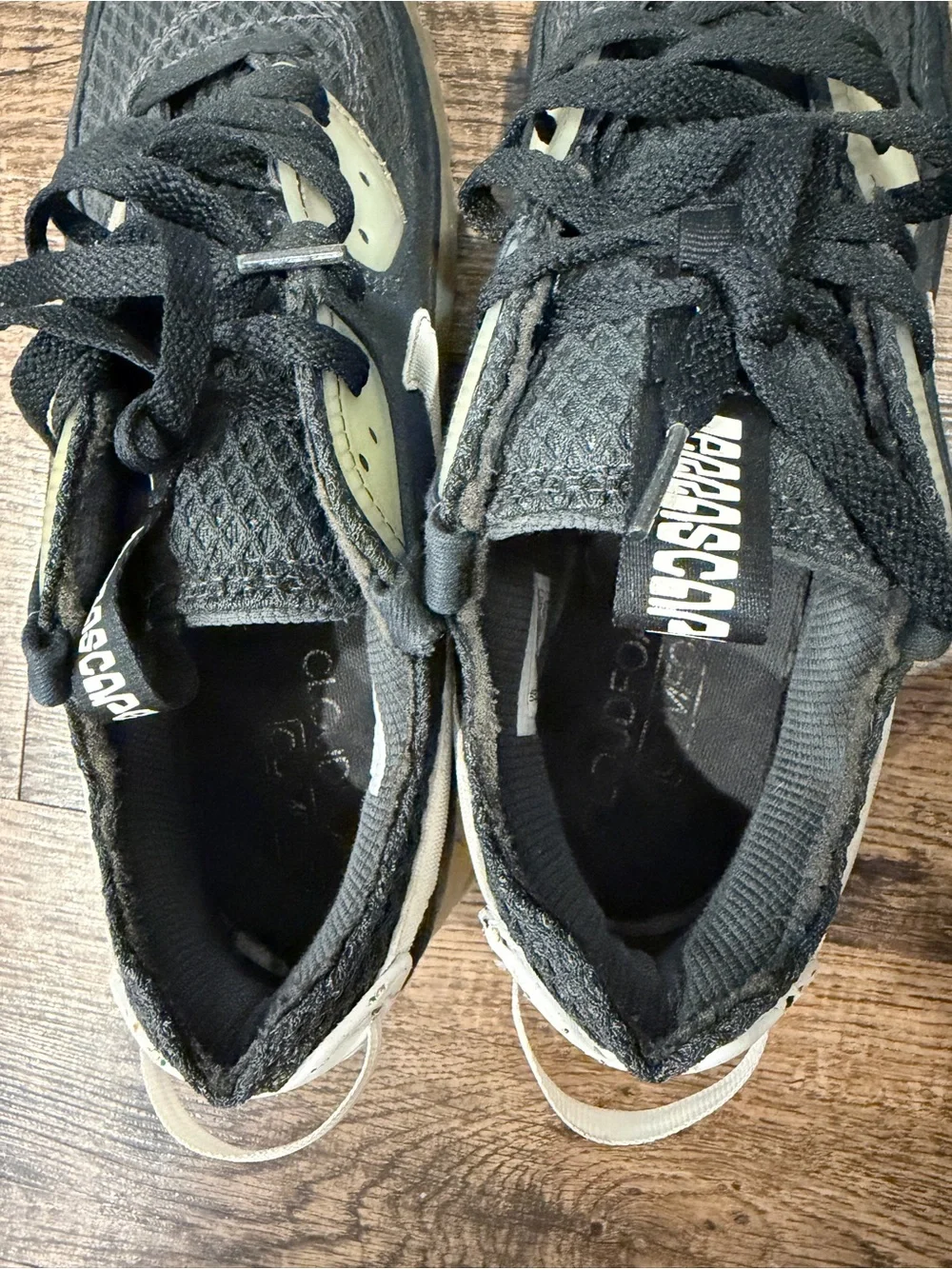 Nike Black Sneaker with White Swoosh and Yellowed Midsole